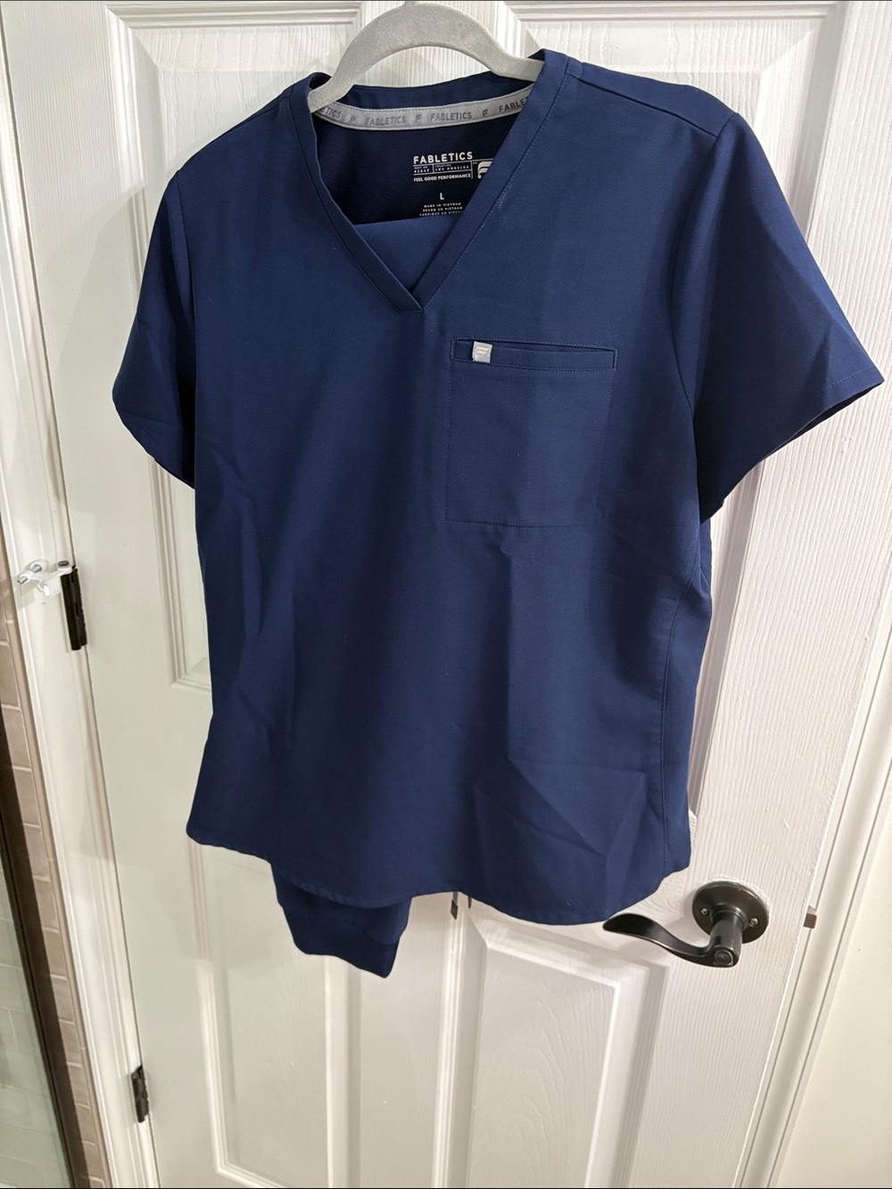 Fabletics womanโs navy Blue Short Sleeve V-Neck with joggers
